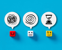 Three dice with stressed, neutral and thoughtful faces and a thought bubble above each