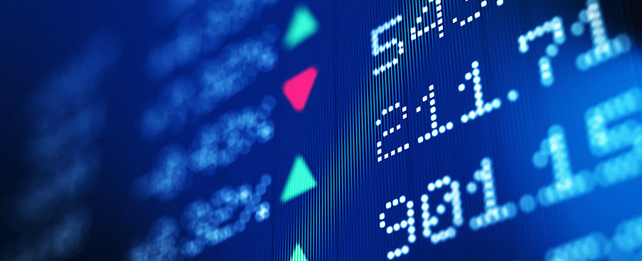 Stock prices on trading board, showing green increase and red decrease.