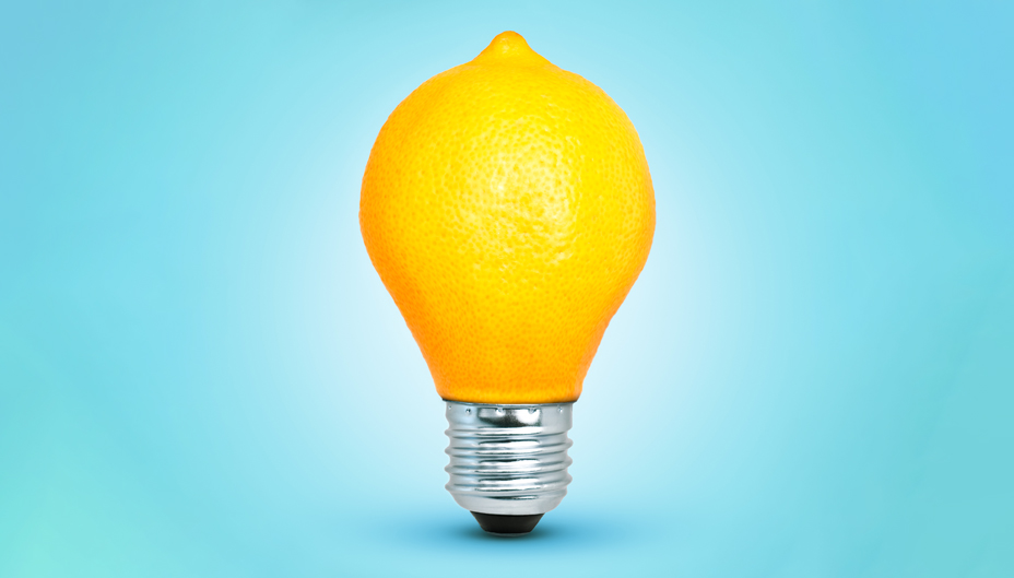 A lightbulb where the glass section has been replaced with a lemon.