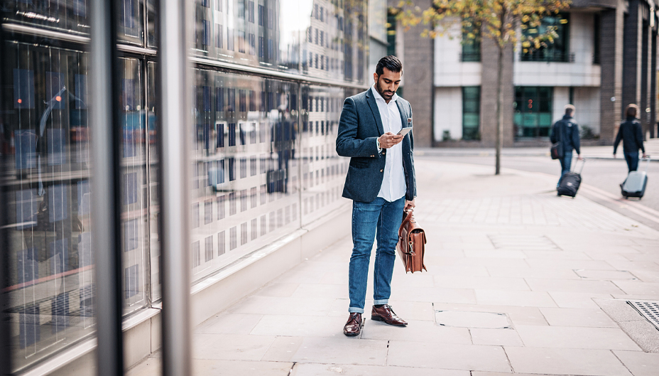 Businessman looking at his phone.