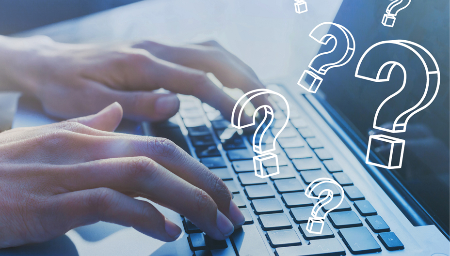 Close-up of hands typing on a laptop with floating question marks.