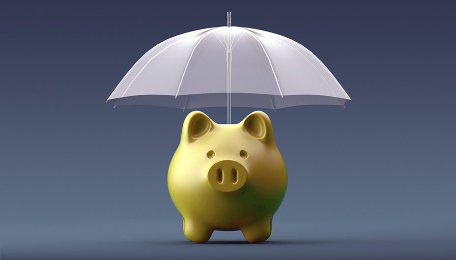 A piggy bank with an umbrella showing the concept of defensive investing.