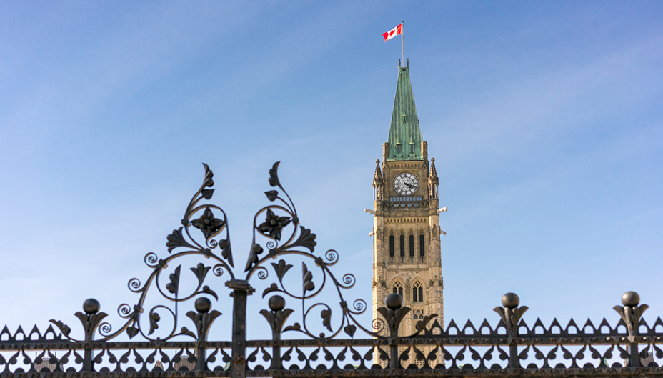 Peace Tower in Ottawa with a gate closed in front of it. 