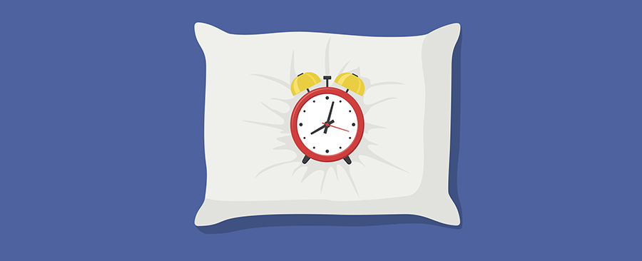 Graphic of an alarm clock on a pillow. 