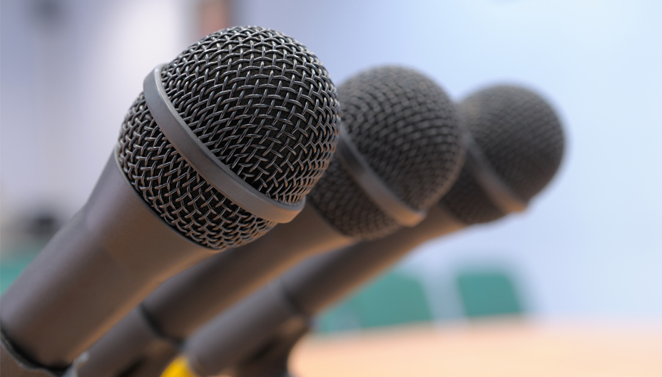 A photo of three microphones. 