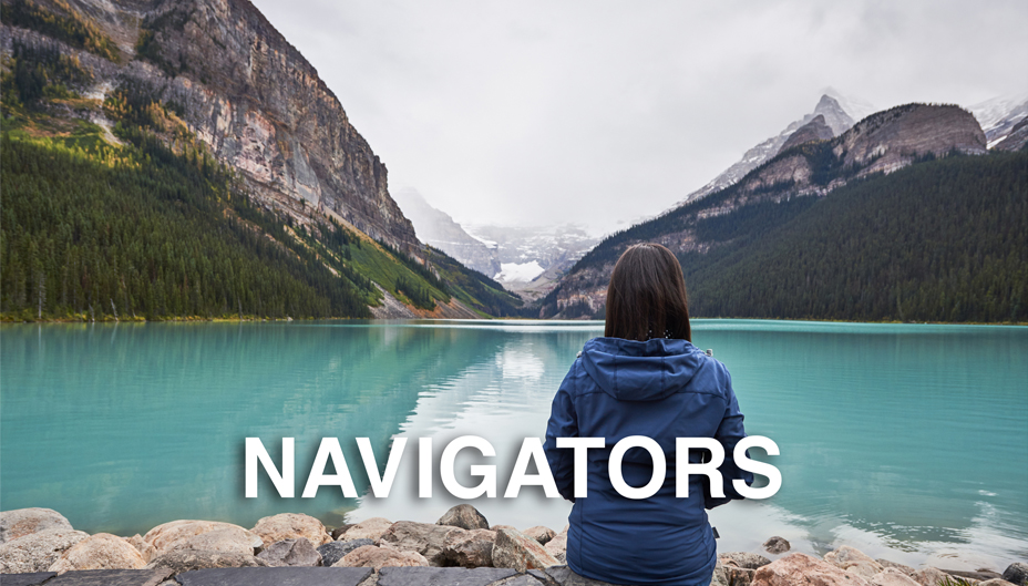 A photograph of a woman sitting at Lake Louise, with the text, "NAVIGATORS" overtop the image.