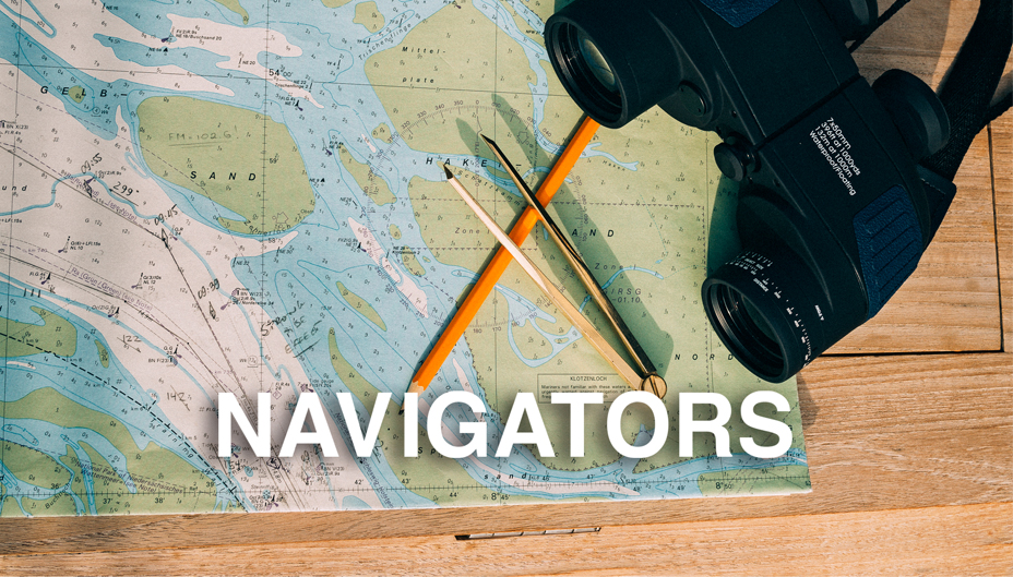 A photo of a map and binoculars with the text, "NAVIGATORS".