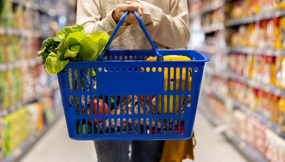A shopping basket is shown in a grocery store.