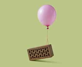 Balloon lifting a brick by a string