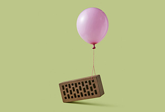 Balloon lifting a brick by a string
