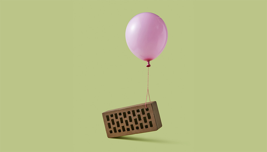 Balloon lifting a brick by a string